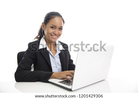 portrait of young business woman working on her laptop isolated on white background
