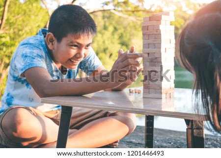 Children are playing stack high games to win the number one.