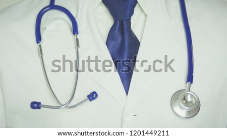 Medical doctor with a stethoscope standing in office