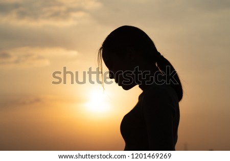 Asian women she felt lonely and alone.silhouette photo
