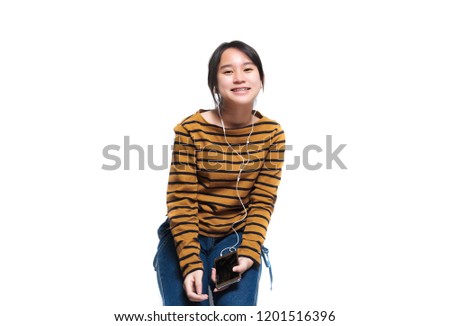 Smiling asian teenager girl isolated over white background
