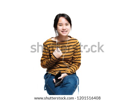 Smiling asian teenager girl isolated over white background
