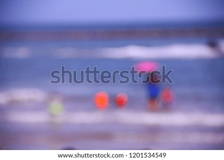 People on the beach, blurred images concept