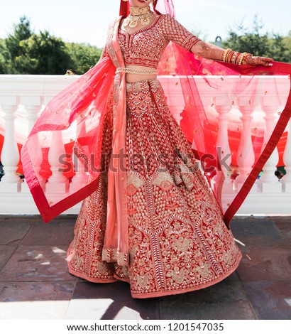 Pakistani Indian Bridal showing wedding lehenga dress and jewellery Royalty-Free Stock Photo #1201547035