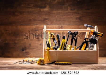 Toolbox With Various Worktools On Wooden Surface Royalty-Free Stock Photo #1201594342