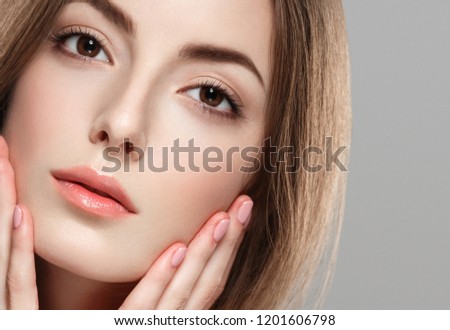 Beautiful brunette woman beauty face closeup macro skin and beautiful eyes