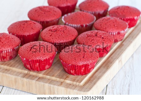 Fresh baked red velvet cupcakes without decoration before making frosting