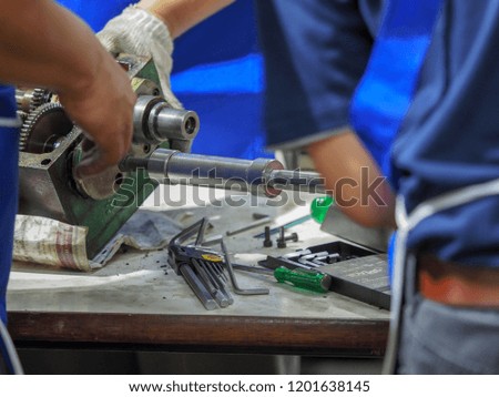 Maintenance technician repair lathe machine
