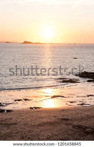 Sunset in summer on the beach the city of St Malo, Brittany, France
