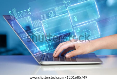 Hand using laptop with database reports and online work concept Royalty-Free Stock Photo #1201685749