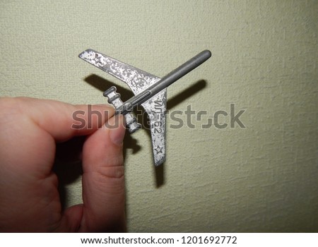 The plane in the hand of a man rise and fall, crash