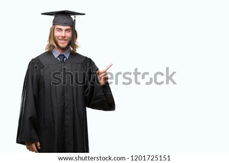 Young handsome graduated man with long hair over isolated background with a big smile on face, pointing with hand and finger to the side looking at the camera.
