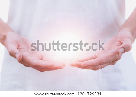 Close up horizontal image of distance healing hands of therapist at Reiki healing treatment. Alternative therapy concept Royalty-Free Stock Photo #1201726531