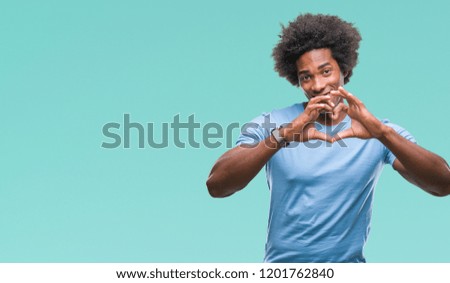 Afro american man over isolated background smiling in love showing heart symbol and shape with hands. Romantic concept.