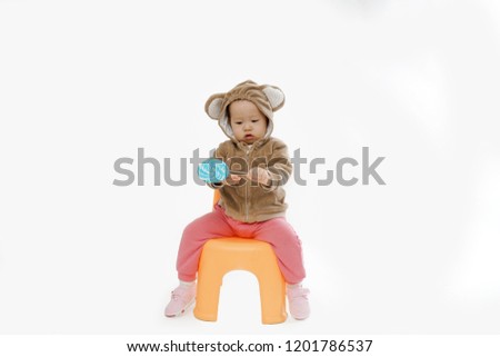   Baby playing on the bench        