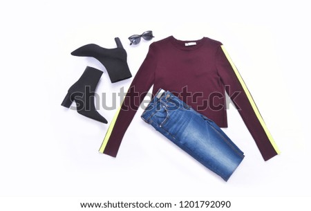 Set of striped clothes with black boots ,sunglasses ,blue jeans on white background
