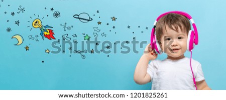 Idea rocket with toddler boy with headphones on a blue background