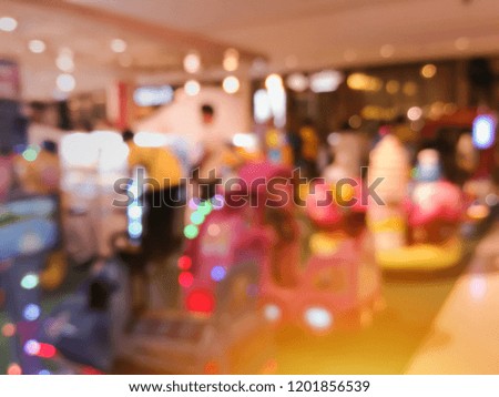 The blurred place for play a game child in department store