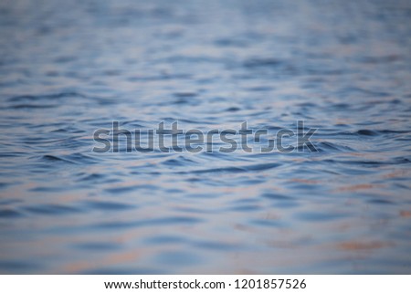 A beautiful water surface close up in the river. Waves with some reflections. Riga, Latvia.