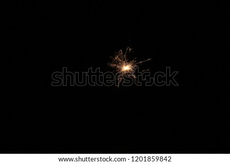 yellow sparks on a black background. 