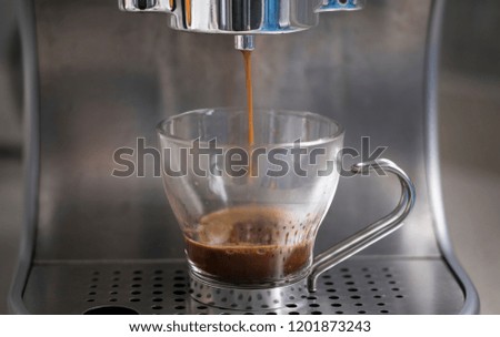 Espresso coffee preparation in a glass cup