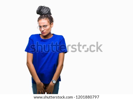 Young braided hair african american girl wearing glasses over isolated background skeptic and nervous, frowning upset because of problem. Negative person.
