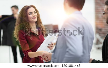 handshake between the designer and the client Royalty-Free Stock Photo #1201881463