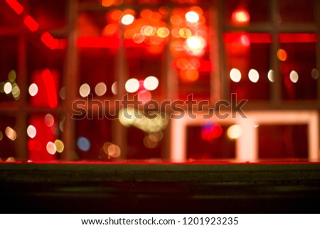 Abstract picture of bokeh lights in the abandoned house with stone table in foreground