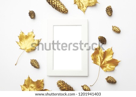 Autumn composition. Frame made of autumn golden leaves on light grey background. Flat lay, top view, copy space