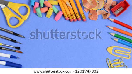 Back to School Concept: Banner sized image with copy space and typical school supplies.