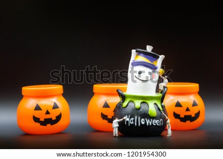 Miniature people: Workers are painting,preparing the Halloween characters and decorations for Halloween night party with copy space using as background. Halloween Traditions and Celebrations concept. 