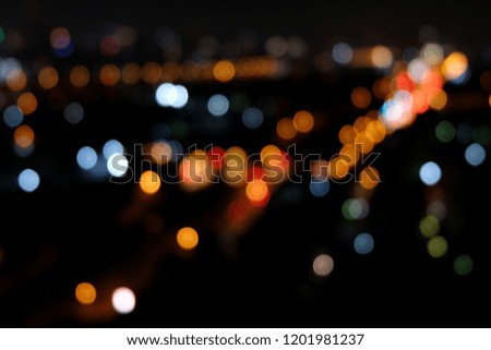 Bokeh of various colorful light within the black background of night sky conditions gives a peaceful feeling.