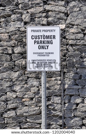 Private property customer parking only signpost