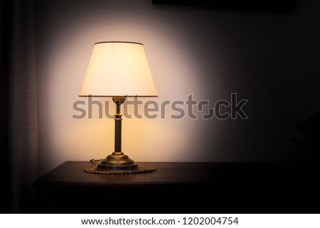Lamp night light in a dark background. Vintage effect style picture. Minimal concept. colorful
