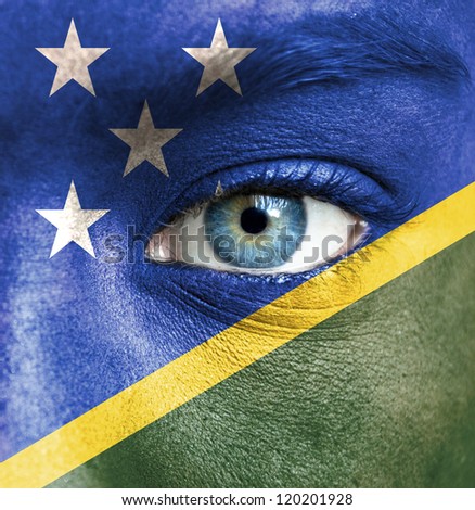 Human face painted with flag of Solomon Islands