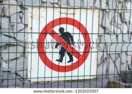 Sign of authorized personnel only at construction site. Red, black and white restricted area, Authorized Personnel Only warning sign on fence. Banned access to not worker at construction site