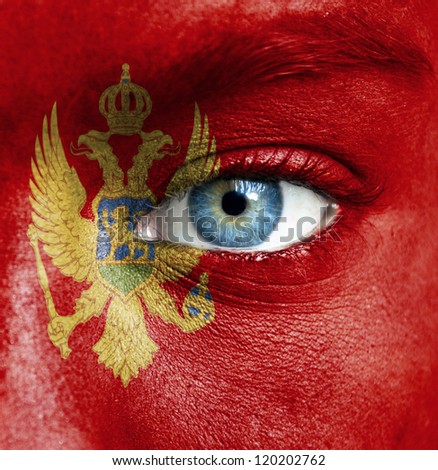 Human face painted with flag of Montenegro