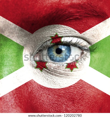 Human face painted with flag of Burundi