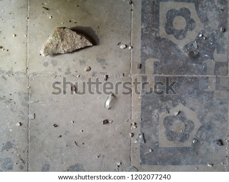 old vintage floor dirty floor tiles texture background with glass and stone cracks