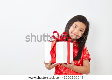 Chinese Girl eight year old girl with Chinese New Year 2019 With receive a red envelope inside of the banknote to bless those who have been happy on white background, Concept New Year Sale,