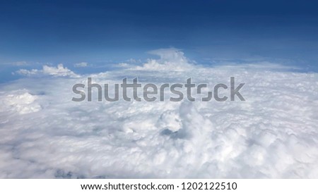 top of cloud wit blue sky, above cloudy skyline