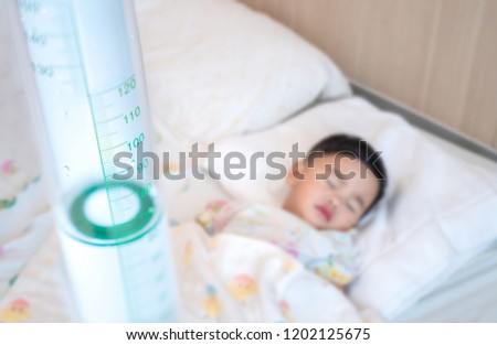 Asian kin sick from influenza and sleep with saling on the bed in Hospital, this picture can use for patirnt, health, flu, faver, insurance and hospital