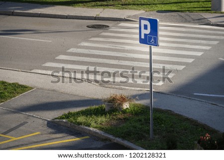 Parking sign near the crosswalk path in Bled, Slovenia.