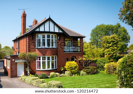 Typical English house with a garden Royalty-Free Stock Photo #120216472