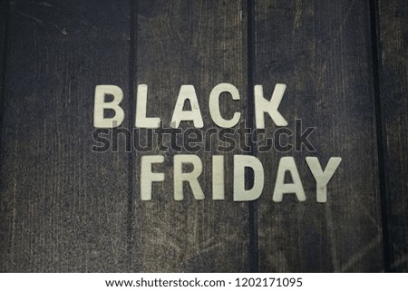 black friday sale shopping concept alphabet on wooden background