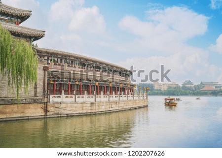 An open view of the lake and the skyline of ancient buildings in Beijing China