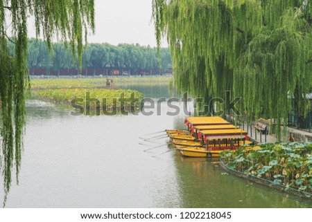 An open view of the lake in Beijing China with a beautiful view of the skyline