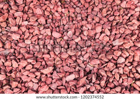 Red stones gravel texture macro background