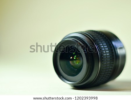 Black lens for a camera on a white background