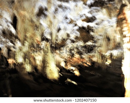 Series of impressionist abstract photographs of prehistoric caves with circular camera movement at low speed